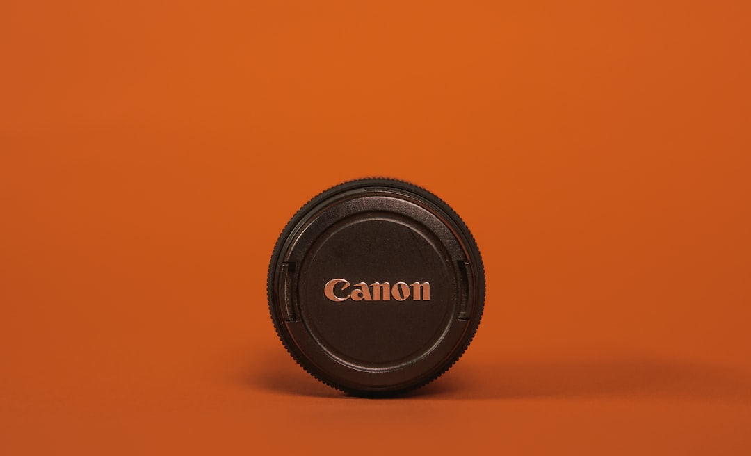 black nikon camera lens cover