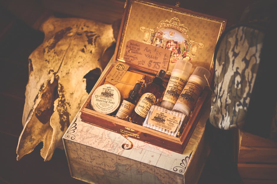 A vintage-style grooming kit featuring shaving soap, oils, and beard balm in an ornate box.