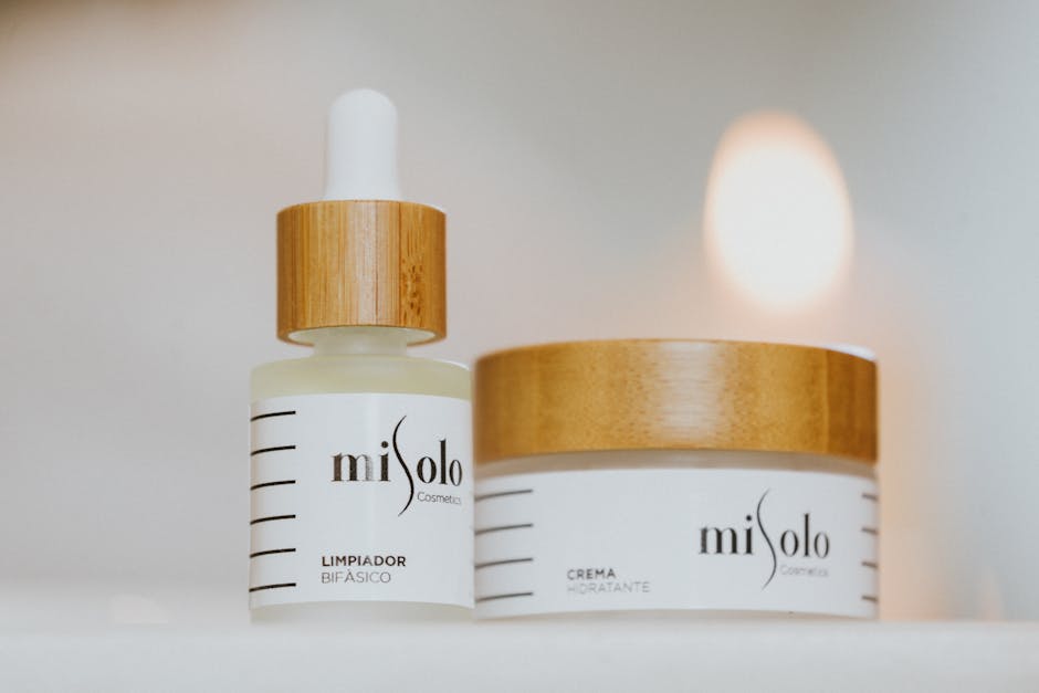 Close-up image of skincare products with bamboo lids on a soft white background.