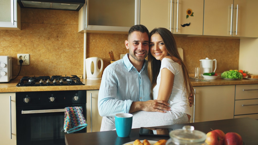 Couple smiling in a modern kitchen