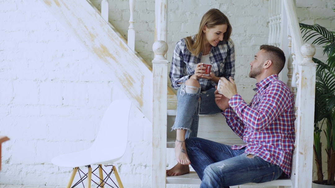 Couple talking while sitting on stairs