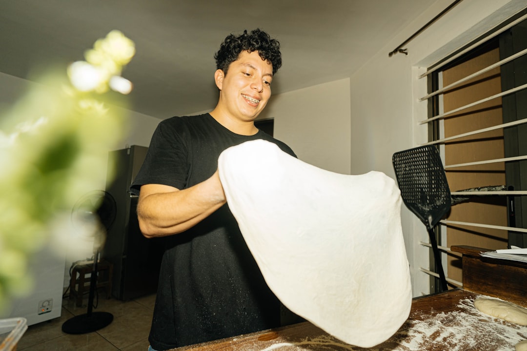 a man holding a roll of white paper