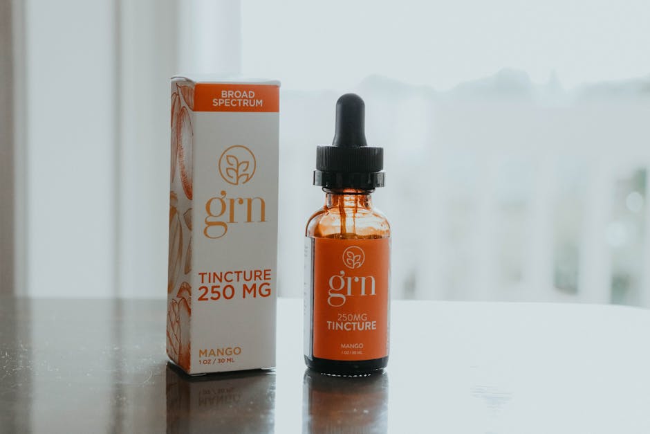 Close-up of a 250mg CBD tincture bottle and packaging in a minimalist style.