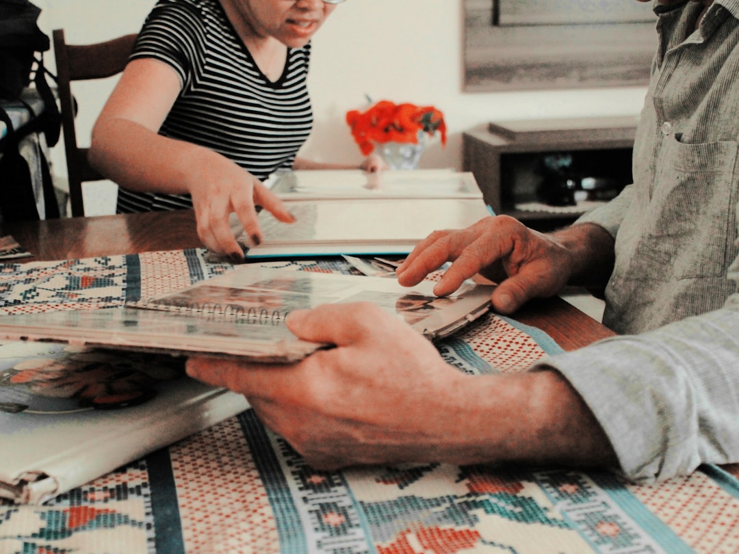 person holding book in front of able