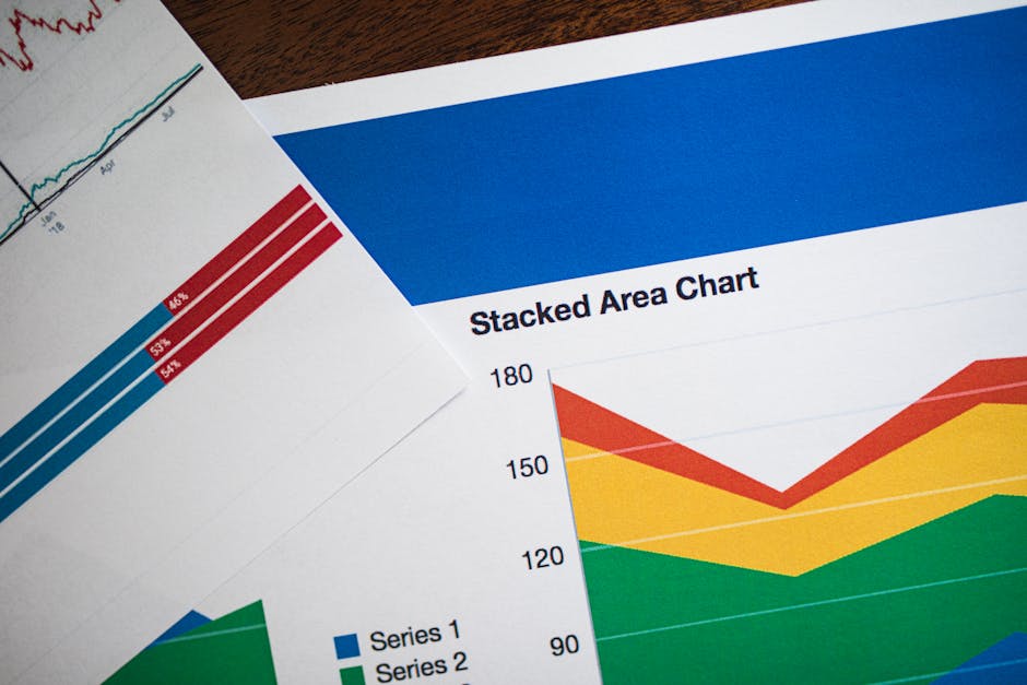 Vivid stacked area chart and graphs on paper, showcasing data analysis.